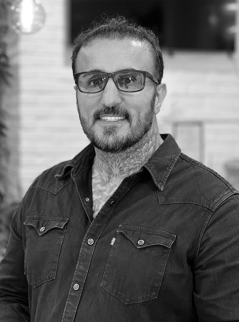 a man with a beard and glasses